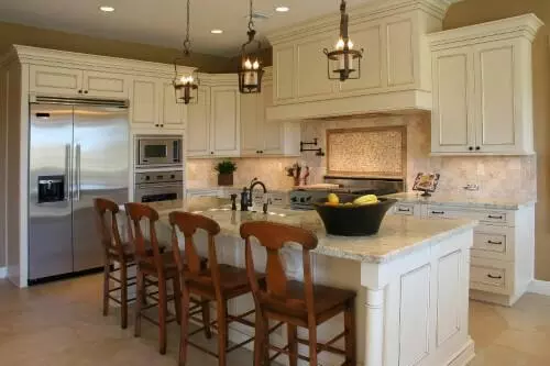 gourmet kitchen with white cabinetry