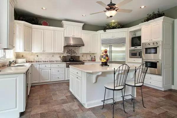 Kitchen in luxury home with large white island